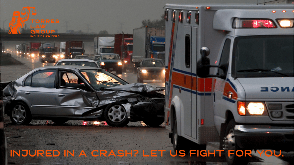 Car accident scene with ambulance with Torres Law Group Inc.branding - Oakland personal injury lawyer